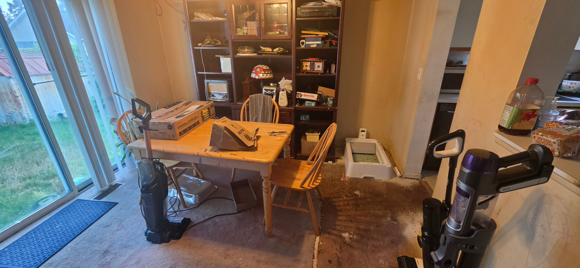Dining area of the Central Islip home leading to the backyard