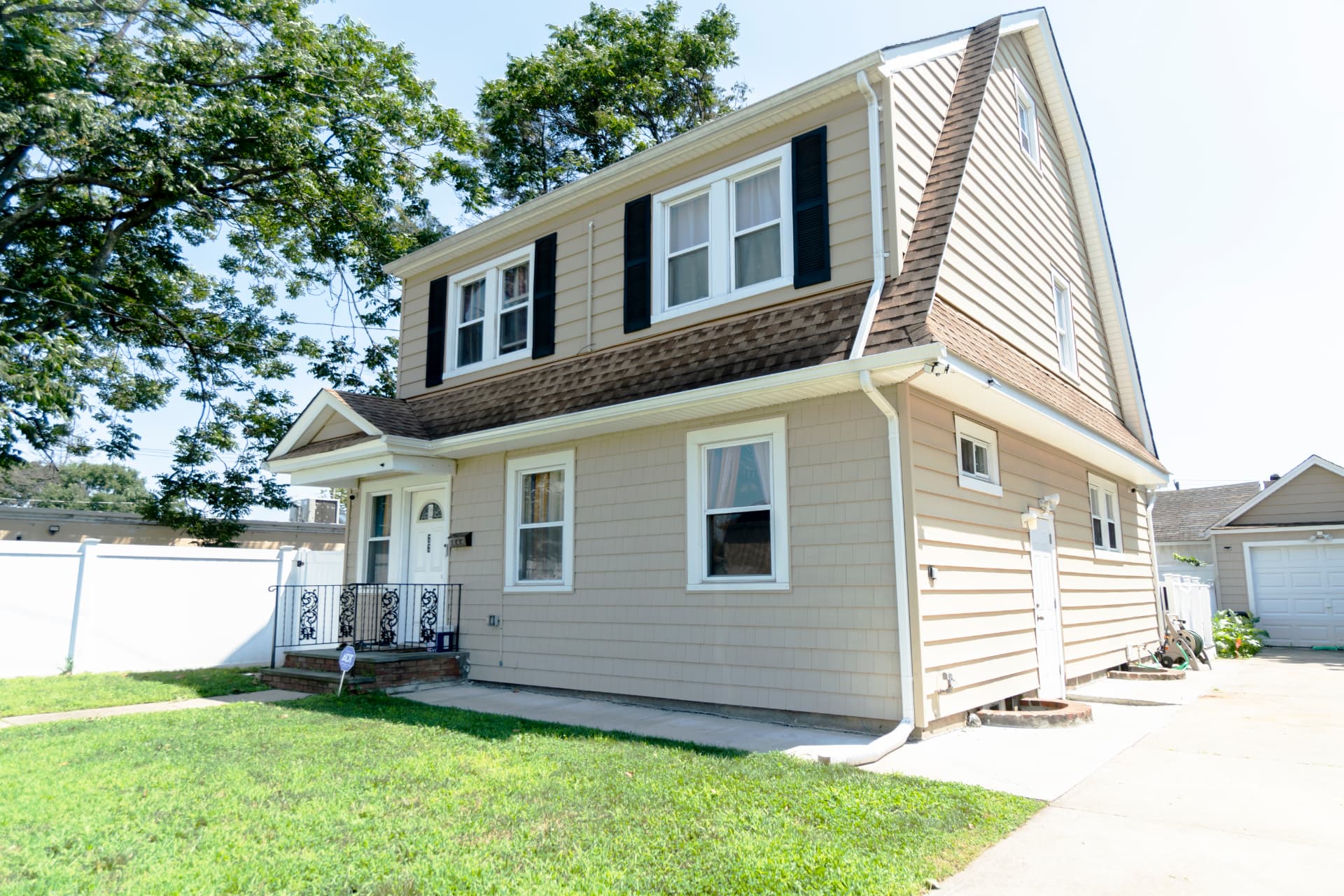 Front exterior of 66 Willow Avenue in Hempstead, New York.