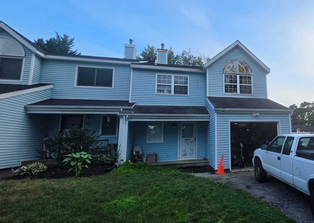 Exterior of the Central Islip townhouse facing foreclosure auction