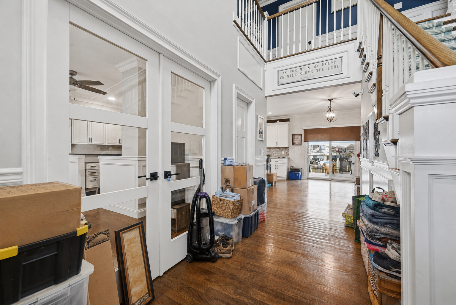 AI-generated clutter simulation of a real hallway, with boxes and belongings placed along the walls while preserving a clear walking path
