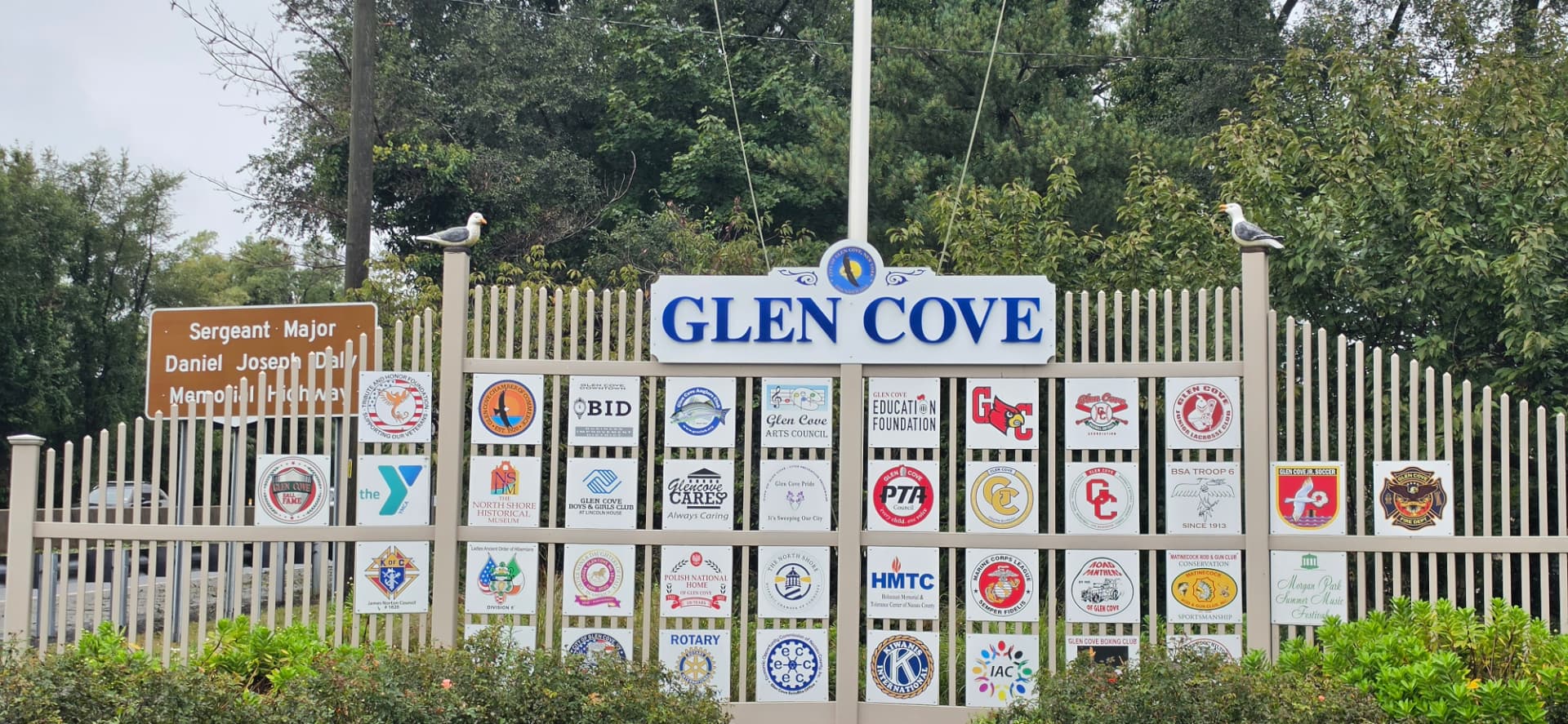 Glen Cove community sign displaying local organizations